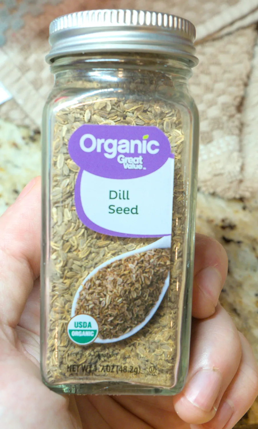 A jar of dill seeds