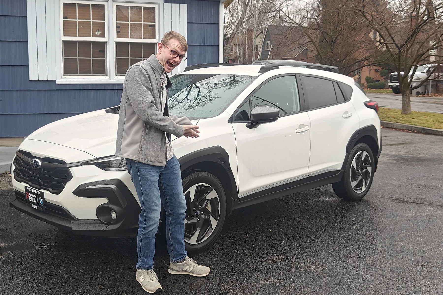 Me standing happily in front of my new Subaru