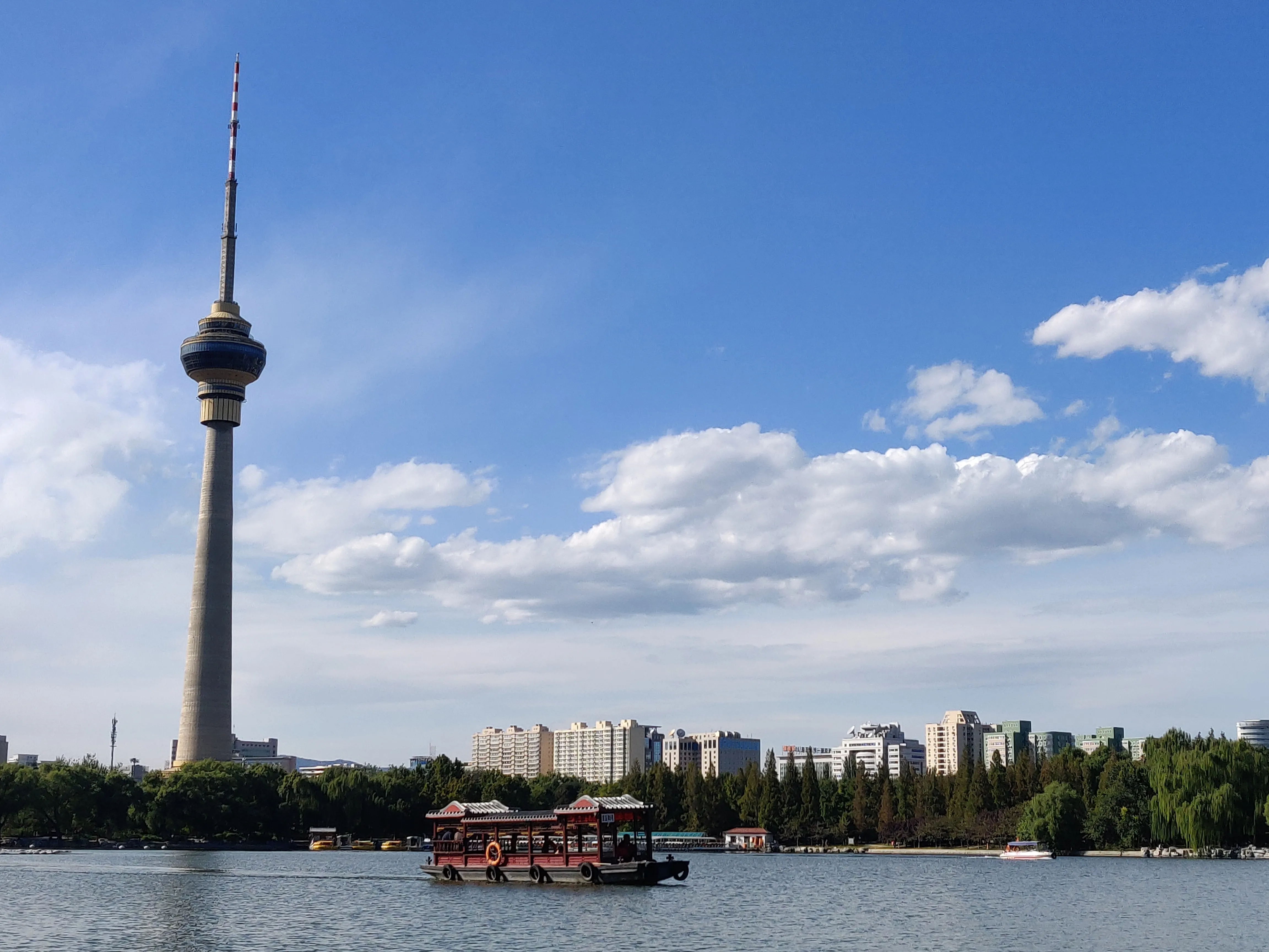 Beijing TV Tower beside a lake at Yuyuantan Park.